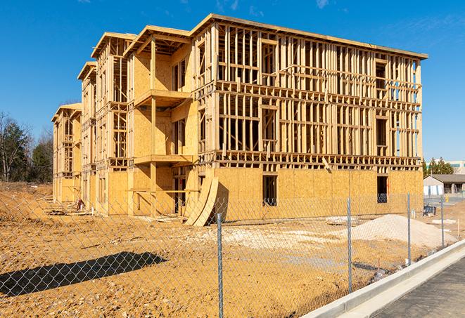 a close-up of temporary chain link fences enclosing a construction site, signaling progress in the project's development in Bingham Farms MI